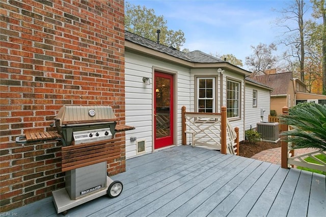 wooden terrace featuring area for grilling and central AC