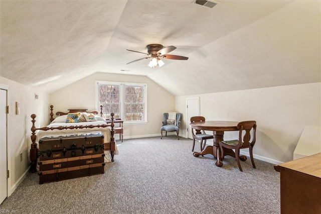 bedroom with vaulted ceiling, ceiling fan, and carpet