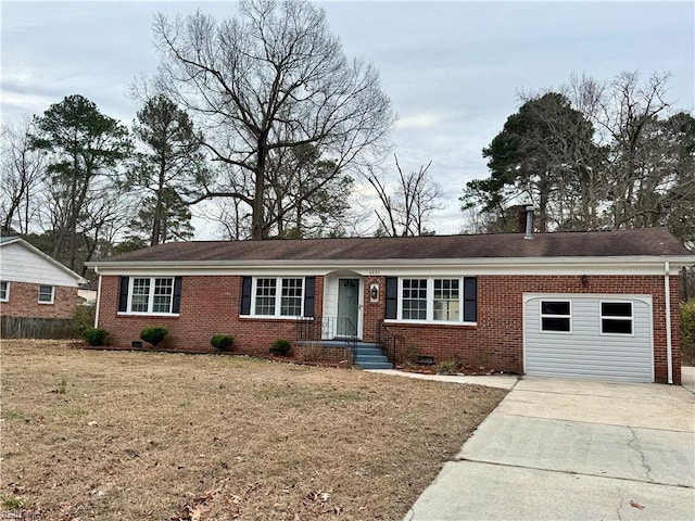 ranch-style home with a garage and a front lawn