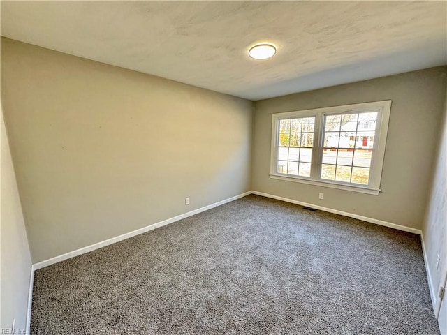 empty room featuring carpet