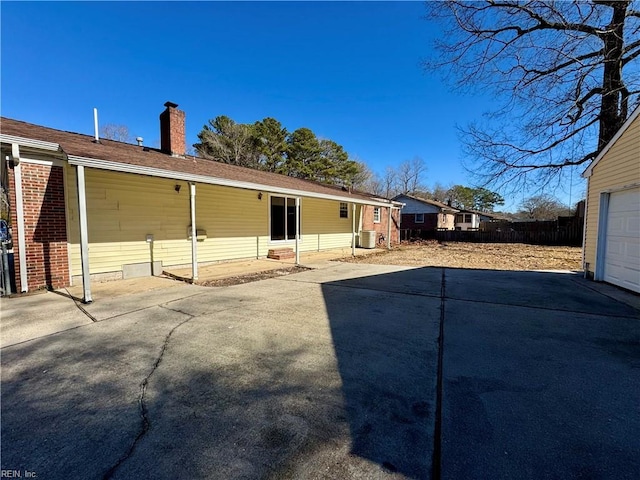 back of house with a garage