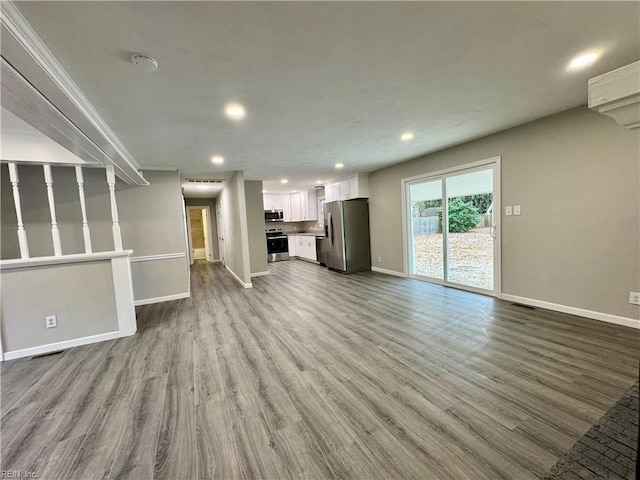 unfurnished living room with light hardwood / wood-style floors