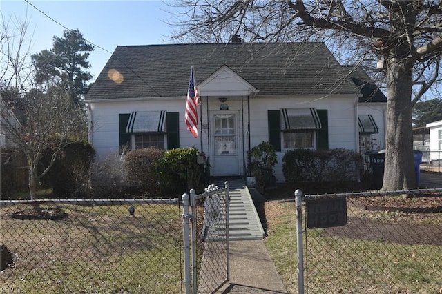 bungalow-style house with a front yard