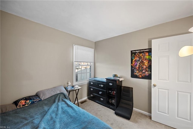 bedroom featuring light carpet