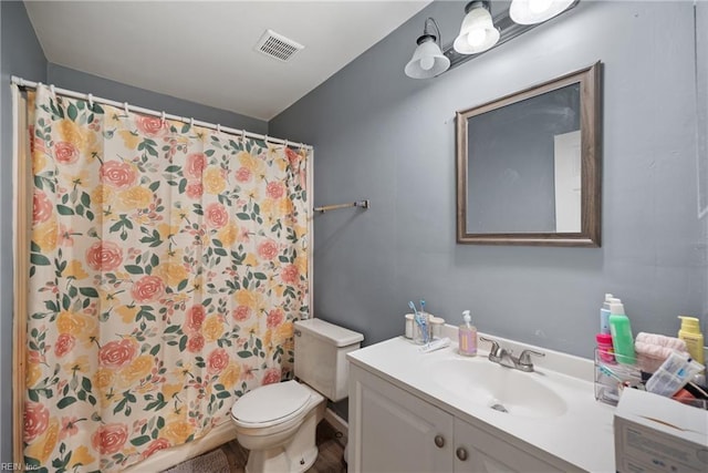 bathroom featuring vanity, a shower with curtain, and toilet