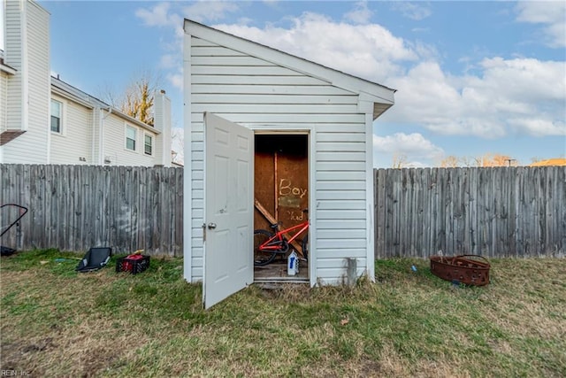 view of outbuilding with a lawn