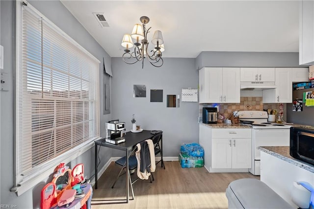 kitchen with white cabinetry, hanging light fixtures, white electric range, and stone counters