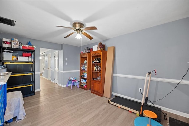 interior space featuring hardwood / wood-style flooring and ceiling fan