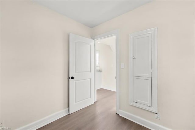 unfurnished room featuring hardwood / wood-style flooring