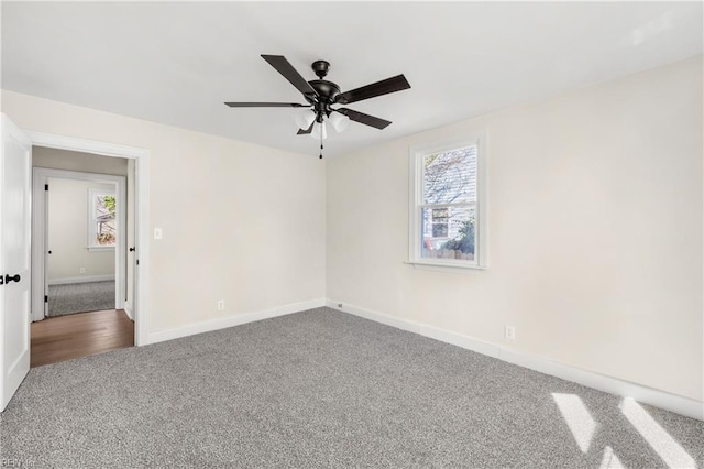 carpeted empty room with ceiling fan