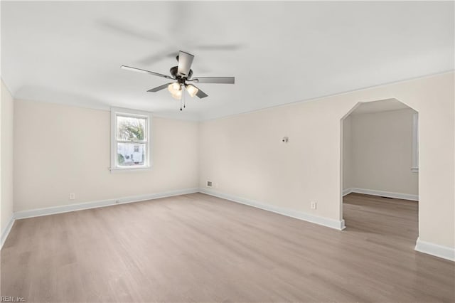 spare room with ceiling fan and light hardwood / wood-style floors