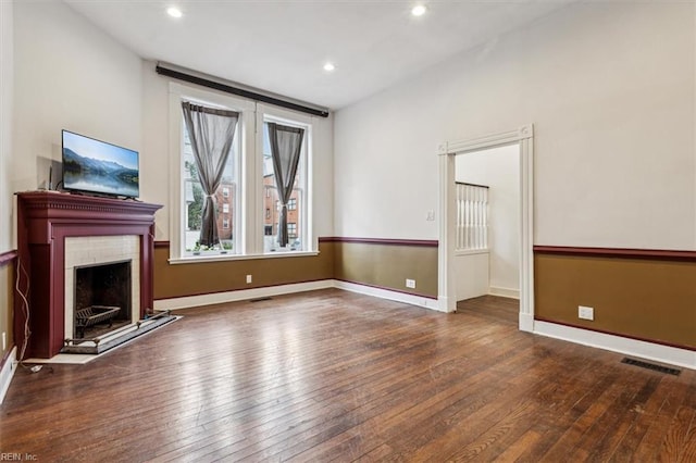 unfurnished living room featuring hardwood / wood-style floors