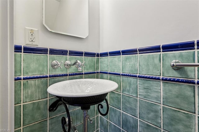 bathroom with tile walls