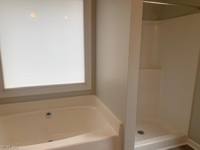 bathroom with independent shower and bath