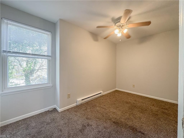 carpeted empty room with a baseboard radiator and ceiling fan