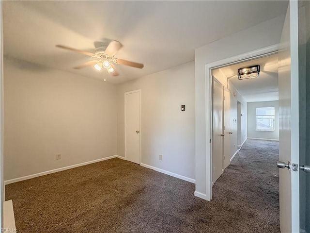 carpeted empty room featuring ceiling fan