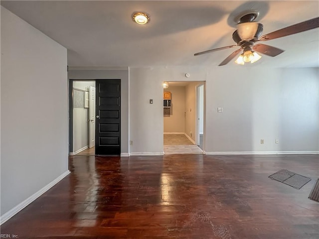 unfurnished room featuring ceiling fan and dark hardwood / wood-style flooring