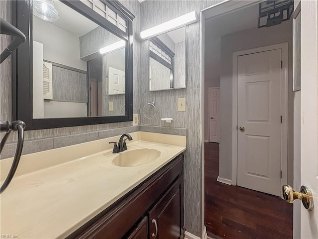 bathroom with vanity and hardwood / wood-style floors