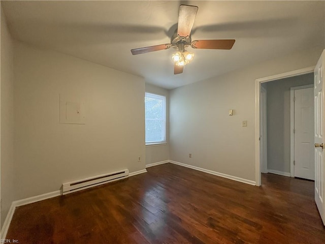 spare room featuring a baseboard radiator, dark hardwood / wood-style floors, and ceiling fan