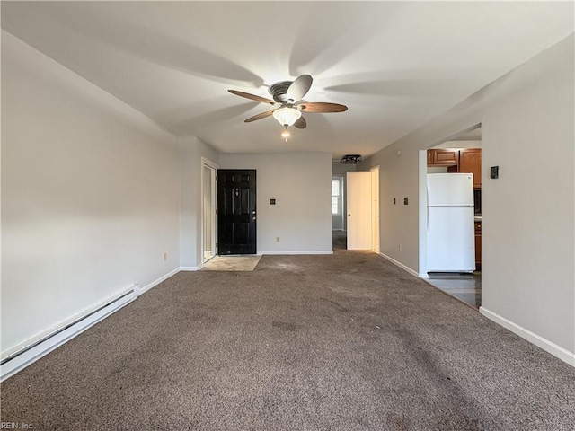 carpeted spare room with a baseboard heating unit and ceiling fan