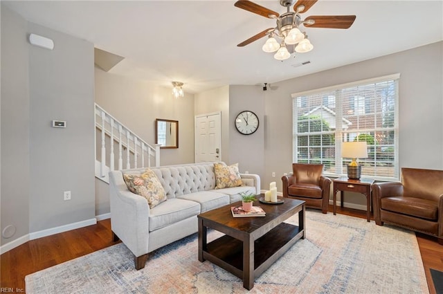 living room featuring ceiling fan and wood-type flooring