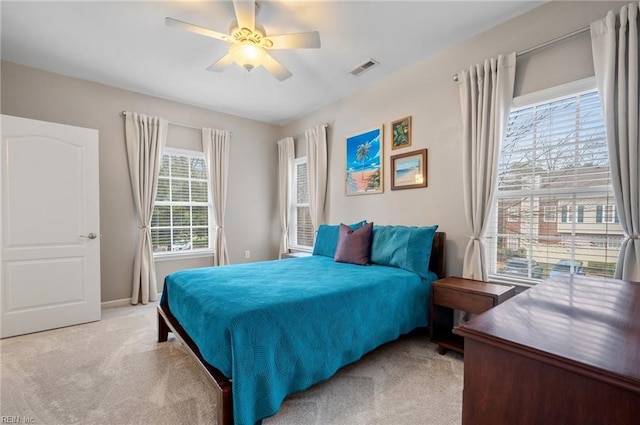 carpeted bedroom with ceiling fan