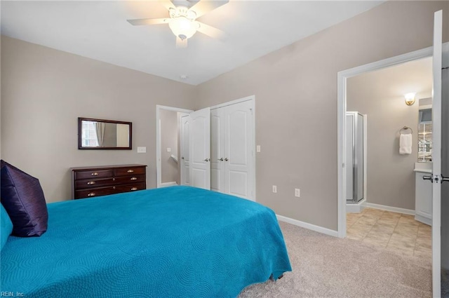 carpeted bedroom with ceiling fan and a closet