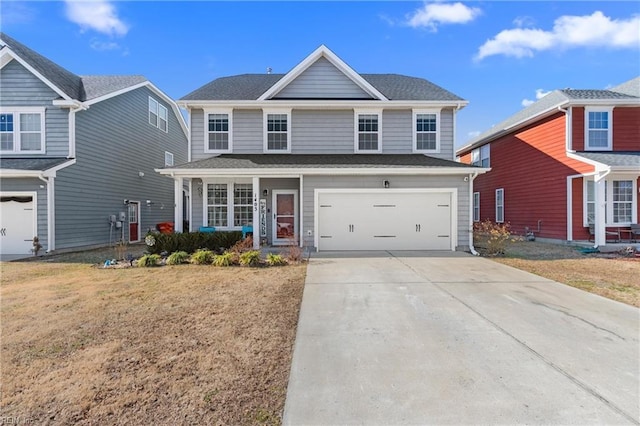 front of property featuring a garage and a front lawn