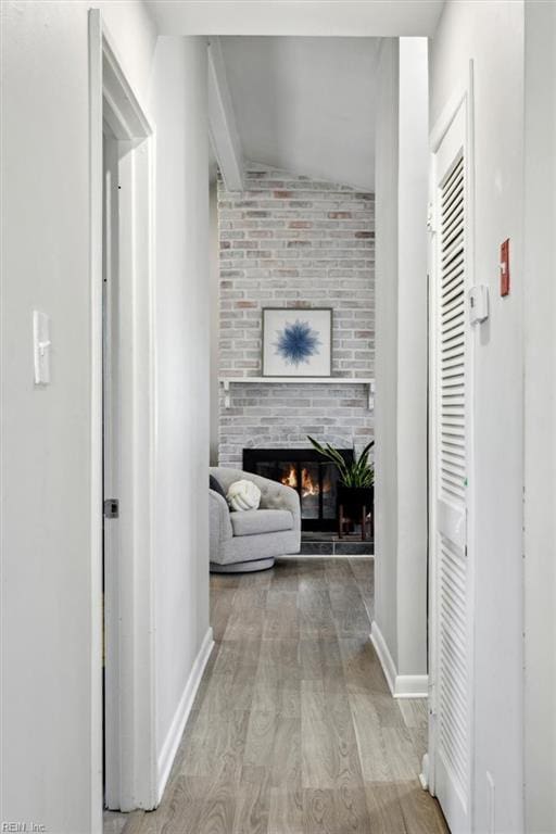 corridor with light wood-type flooring