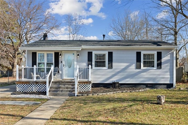 view of front facade with covered porch and a front yard