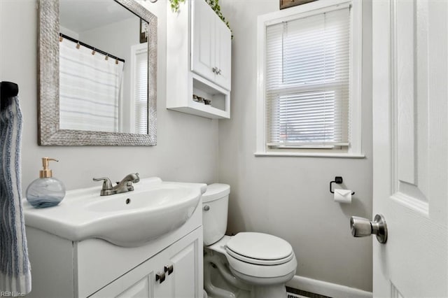 bathroom featuring vanity and toilet