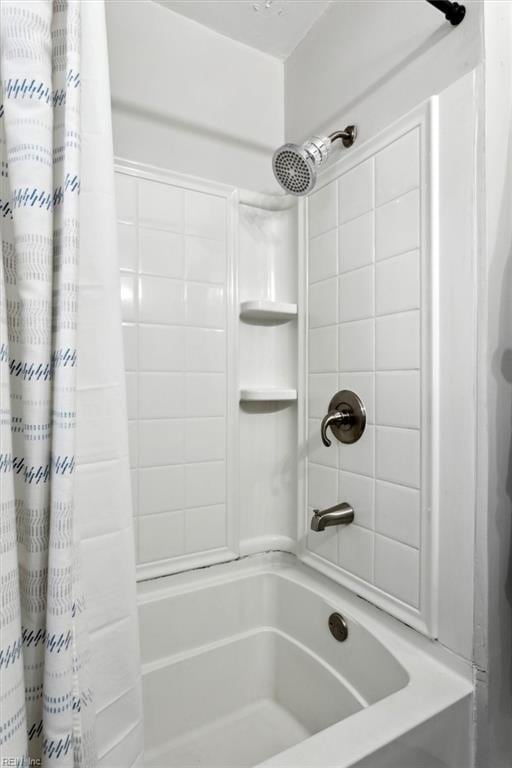 bathroom with shower / tub combo with curtain