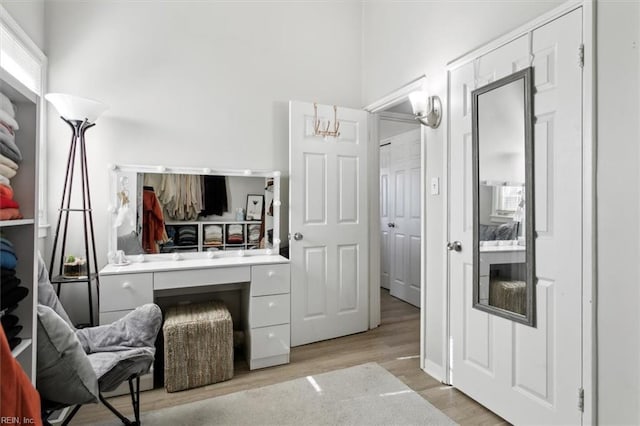 bathroom with vanity and hardwood / wood-style flooring