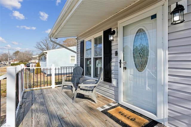 view of exterior entry featuring a porch