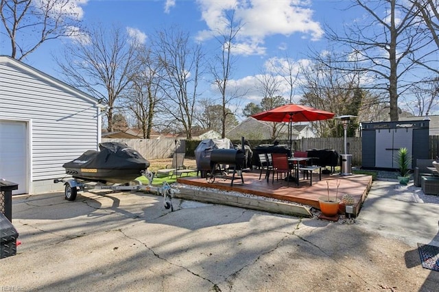 view of patio featuring a shed