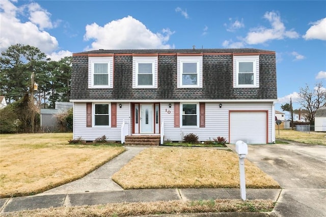 view of front facade with a garage and a front lawn