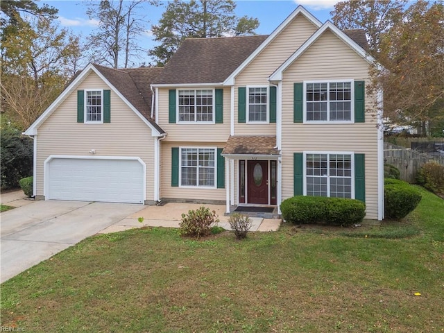 view of front of house featuring a garage and a front yard