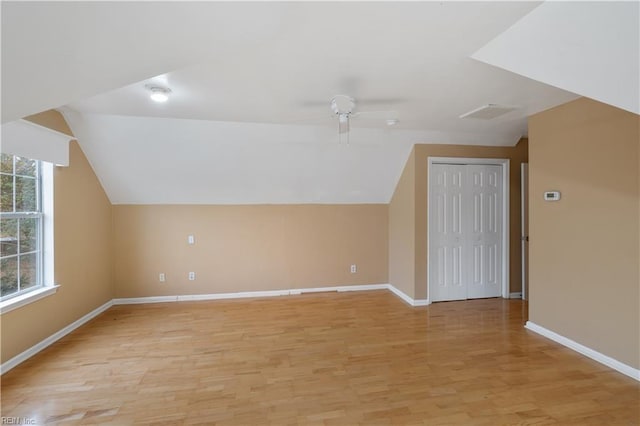 bonus room featuring ceiling fan, lofted ceiling, and light hardwood / wood-style flooring