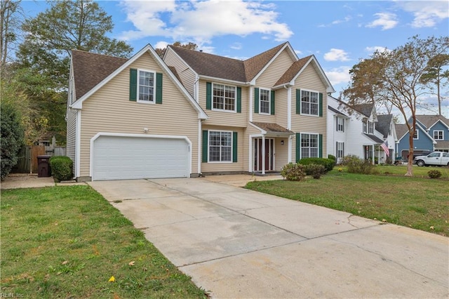 view of front of home featuring a garage and a front yard