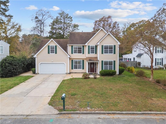 view of front of home with a garage and a front lawn