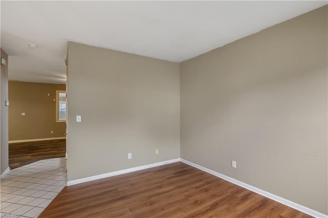 unfurnished room with light wood-type flooring