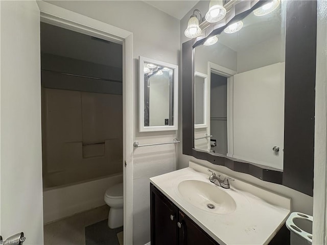 full bathroom featuring vanity, toilet, and washtub / shower combination