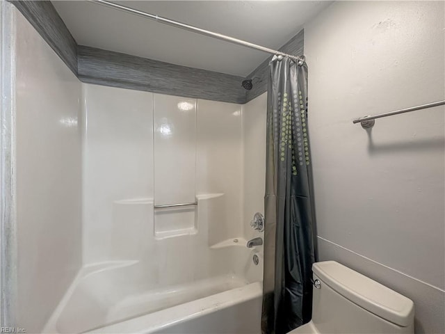 bathroom with shower / bathtub combination with curtain and toilet