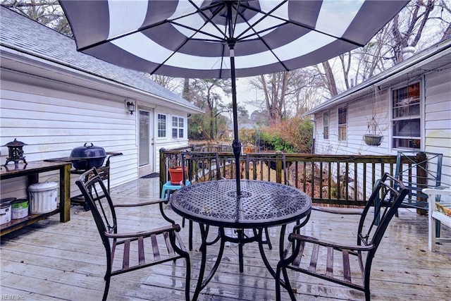 wooden deck featuring grilling area