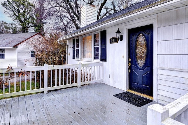 doorway to property featuring a wooden deck