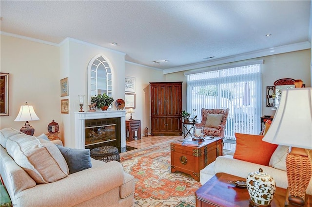 living room featuring crown molding and light hardwood / wood-style flooring