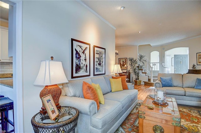 living room featuring crown molding and wood-type flooring