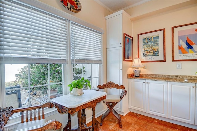 dining area featuring crown molding