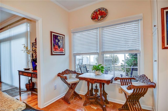 dining space with crown molding