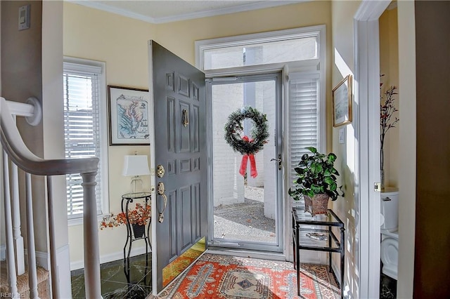 foyer featuring crown molding